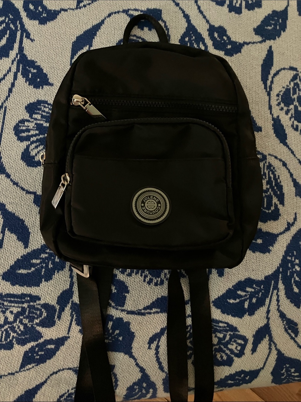 Sleek Black Mini Backpack with Front Pocket